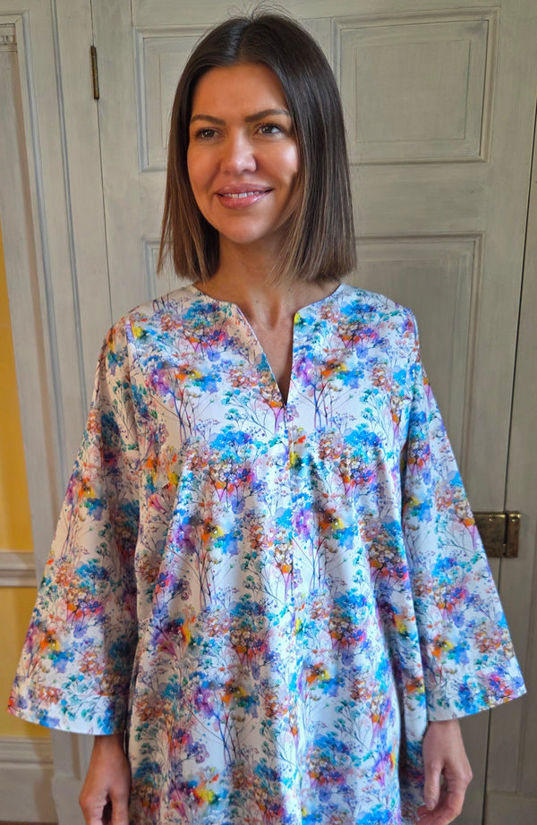 Model wearing a floral kaftan by Tuttabankem.